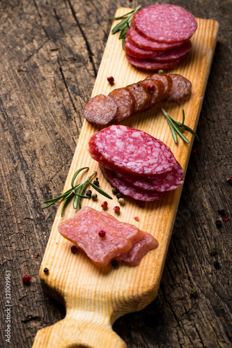 Antipasti dish with bacon; jerky; salami; meat appetizer is a great idea for a beer