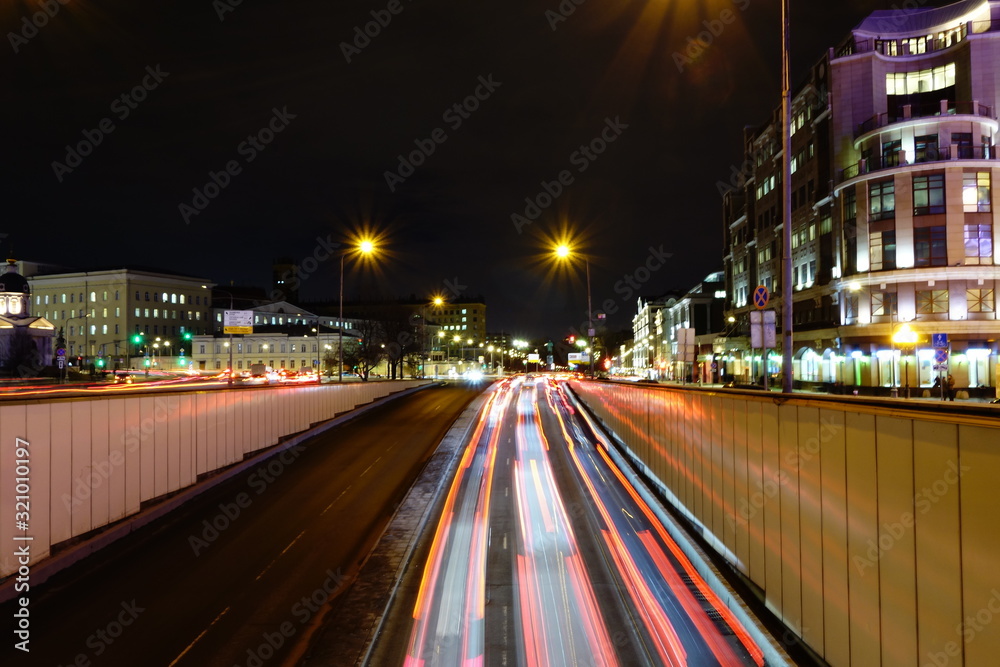 Fototapeta premium Urban view with traffic at night off Arbat street in Moscow