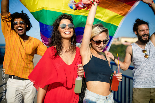 Group of friends, people attend a gay pride event