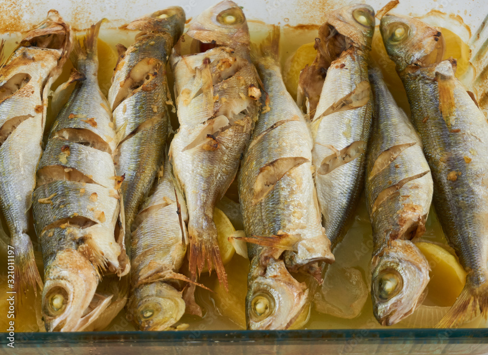 Fototapeta premium Grilled healthy fish near plan shot