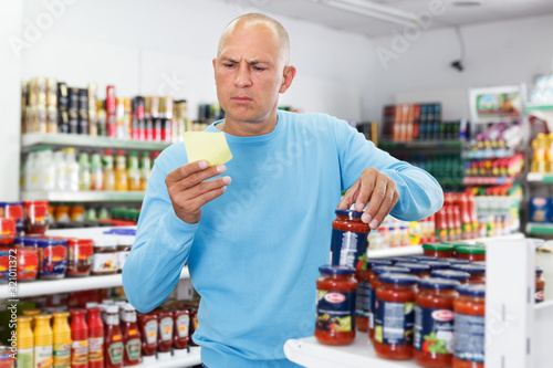 Man buying food in supermarket