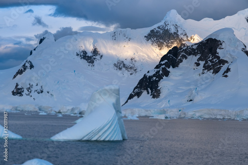 Sunset over the Stunning icy landscapes, Chiriguano Bay, Danko Island, Antarctic Peninsula, Antarctica photo