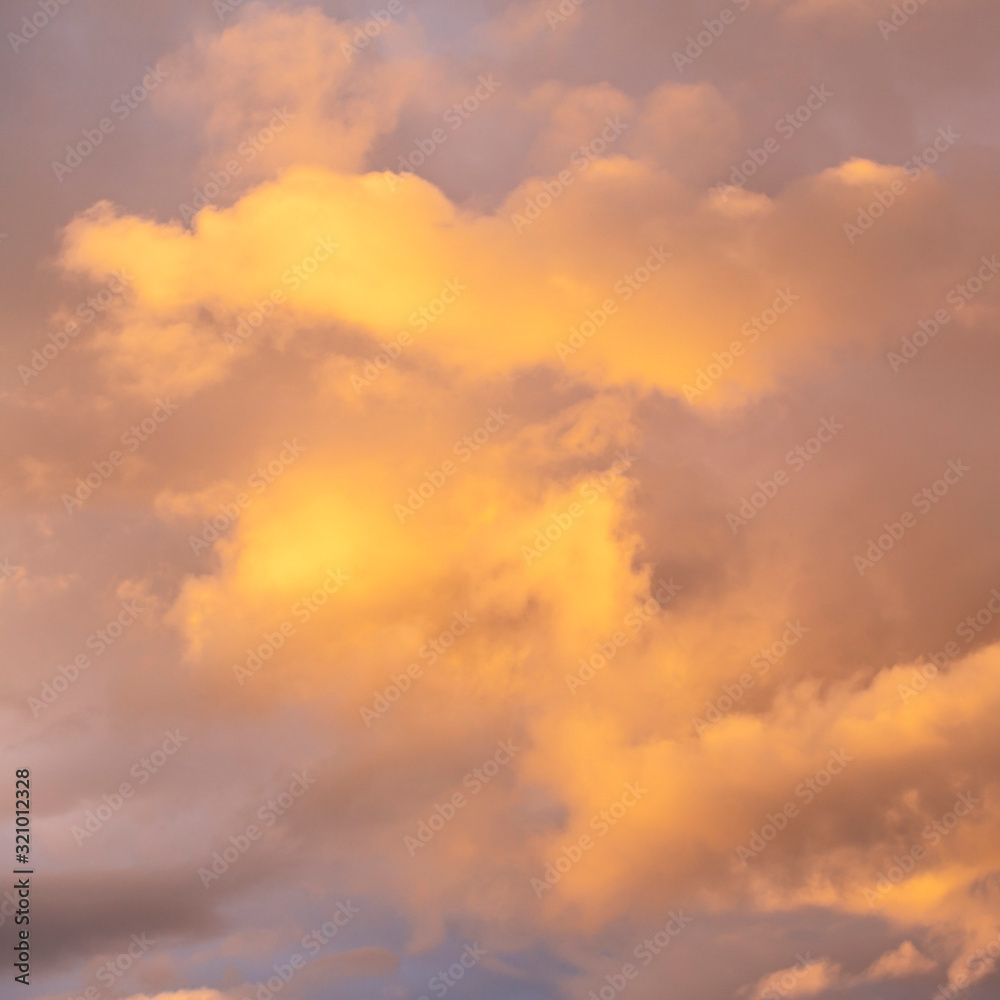 evening sky with beautifully sunlit clouds as a natural background