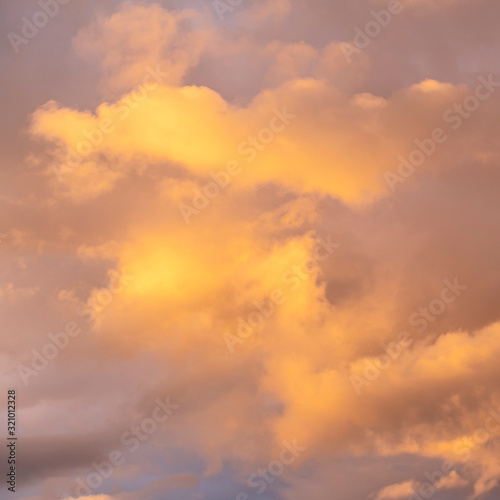 evening sky with beautifully sunlit clouds as a natural background © westermak15