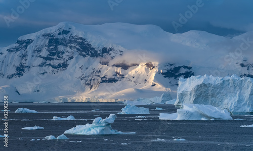 Sunset over the Stunning icy landscapes, Chiriguano Bay, Danko Island, Antarctic Peninsula, Antarctica photo