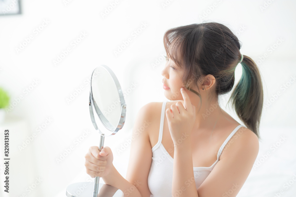 Beautiful face young asian woman with happy smiling and looking mirror, makeup of beauty facial girl with skincare and cosmetic treatment, refresh of female and clean for charming, healthy concept. Beautiful face young asian woman with happy smiling and looking mirror, makeup of beauty facial girl with skincare and cosmetic treatment, refresh of female and clean for charming, healthy concept.