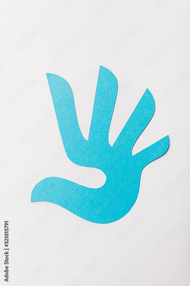 Obraz premium top view of blue paper cut print isolated on white, human rights concept