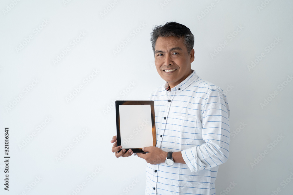 asian mature businessman using tablet pc. connect trough technology