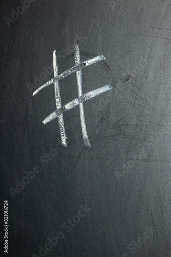 A sign of diez, hashtag painted on a chalk board
