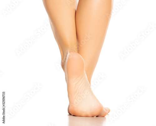 beautiful female foot on white