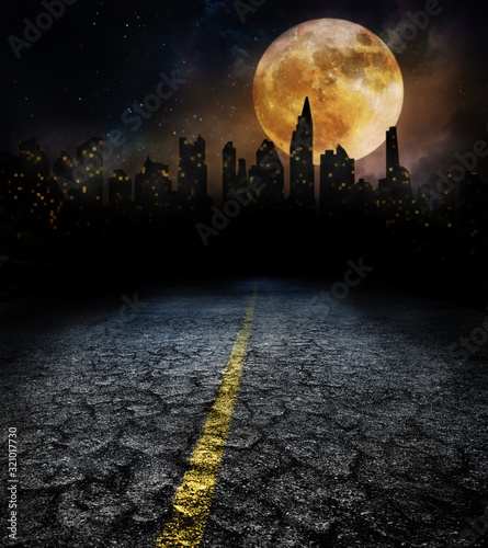 city lights in night and old road with full moon photo