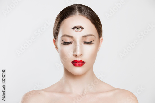 Psychic. Woman with 3 third eye looking at you camera concentrating thinking with mind and heart intuition about problem isolated white grey background. Making smart decision find solution concept