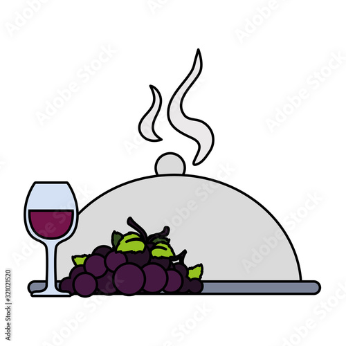 wine glass with grapes and tray server on white background