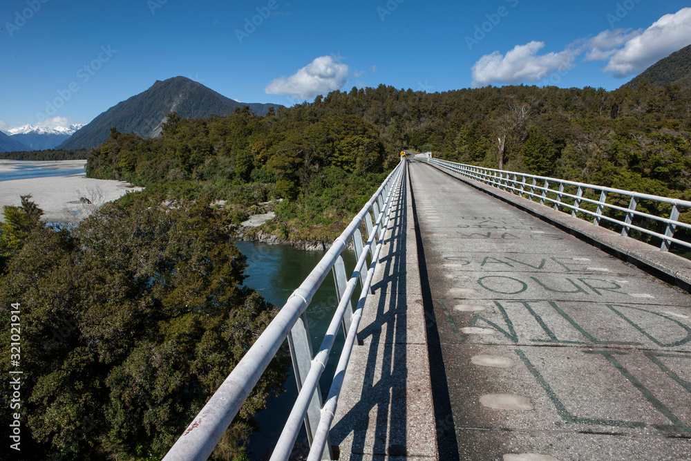 Road to Jackson bay. Westcoast New Zealand. Bridge Okuru river. 