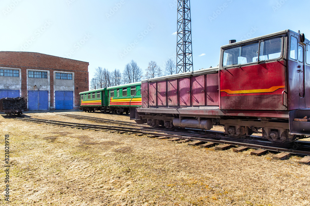 Narrow-gauge railway locomotive and carriage. Alapaevskaya narrow-gauge railway. Russia Narrow-gauge railway locomotive and carriage. Alapaevskaya narrow-gauge railway. Russia