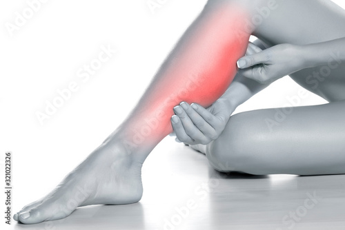 Obraz na plátne woman massaging her painful leg