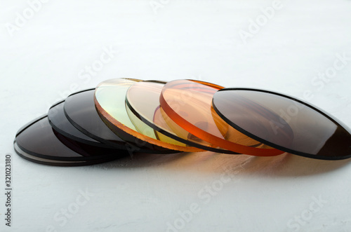 Closeup of different colored optical corrective lenses for eyewear photo