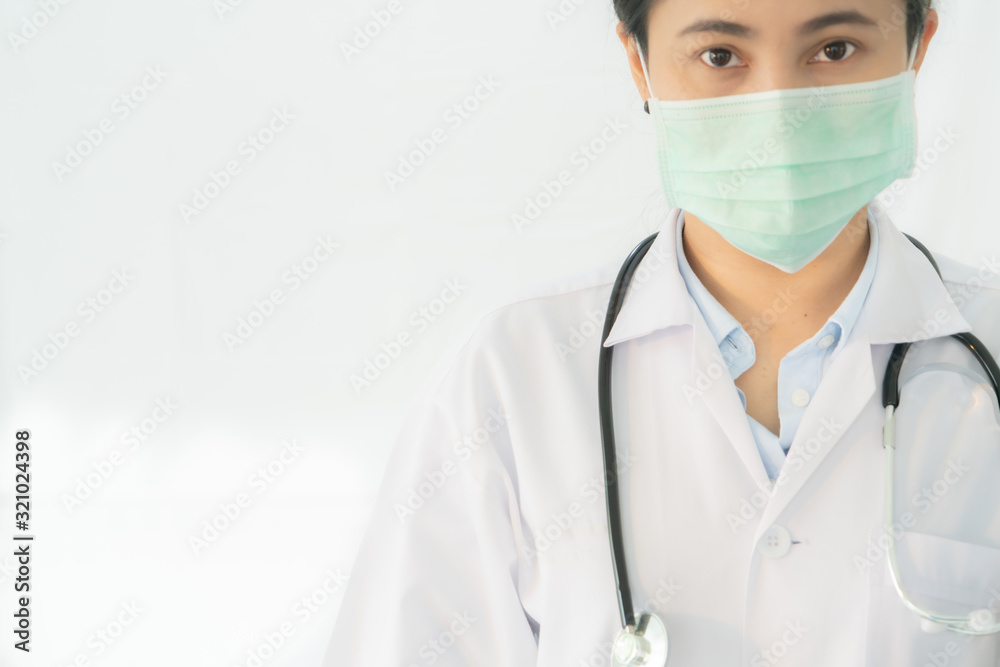 Coronavirus stop infection. young female doctor or intern wearing protective mask and stethoscope against infectious diseases and flu. Healthcare concept Coronavirus stop infection. young female doctor or intern wearing protective mask and stethoscope against infectious diseases and flu. Healthcare concept
