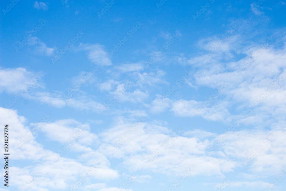 Bright blue sky with white clouds for background or wallpapers