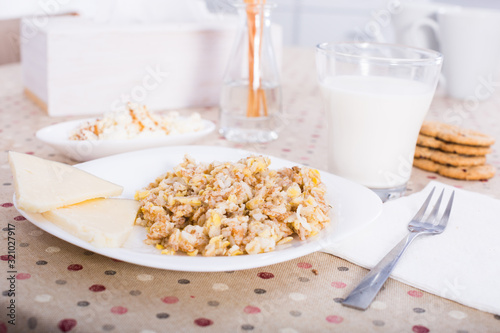 still life of milk, biscuits, porridge from cereals photo