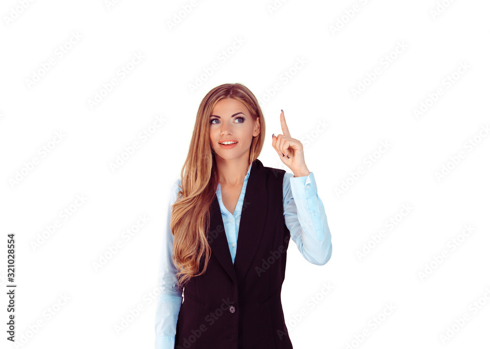 Look up here. Portrait happy beautiful woman having idea pointing up with finger at blank copy space isolated light gray white background. Positive human face expression emotion Look up here. Portrait happy beautiful woman having idea pointing up with finger at blank copy space isolated light gray white background. Positive human face expression emotion