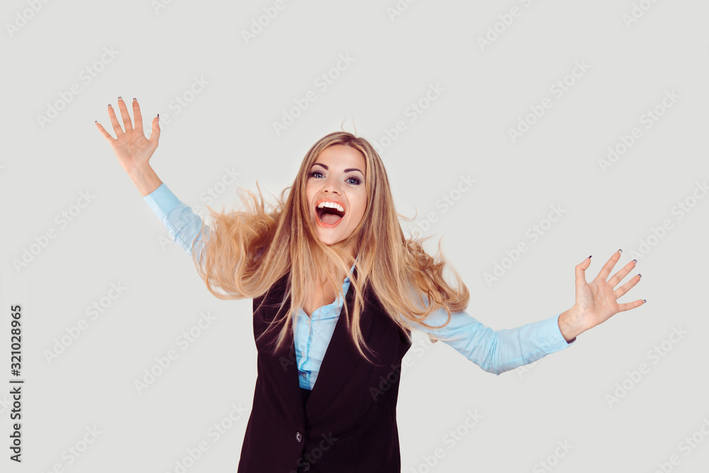 Closeup portrait of happy excited girl. Young beautiful woman smiling surprised, hands in air amazed isolated on light grey white background. Positive human emotion face expression feeling attitude Closeup portrait of happy excited girl. Young beautiful woman smiling surprised, hands in air amazed isolated on light grey white background. Positive human emotion face expression feeling attitude
