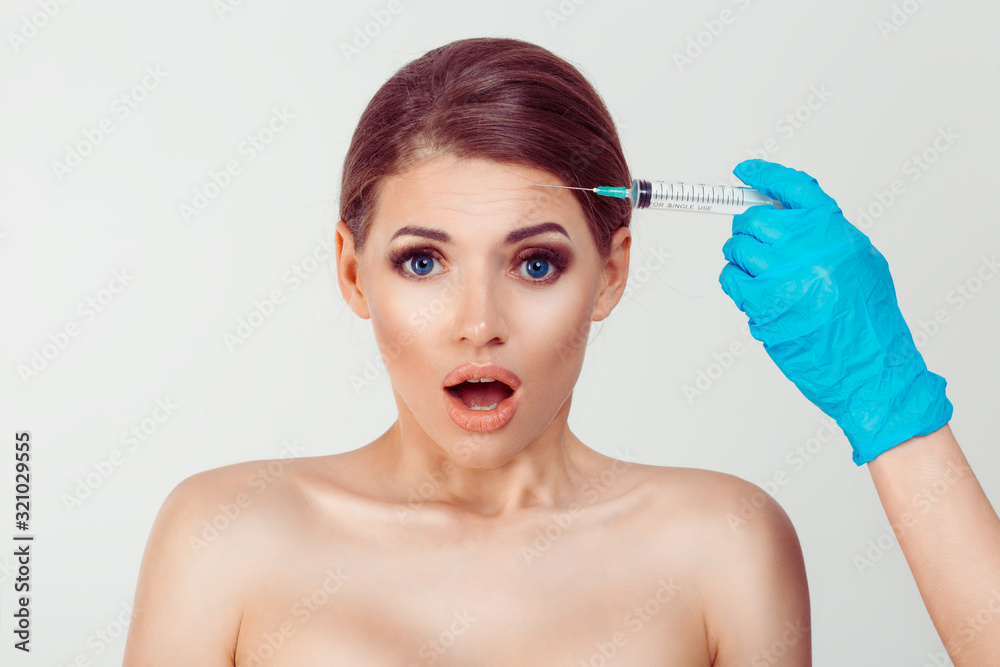 Woman afraid shocked of filler botulinum toxin injection hyaluronic acid shot anti wrinkles aesthetic surgery, isolated white background Woman afraid shocked of filler botulinum toxin injection hyaluronic acid shot anti wrinkles aesthetic surgery, isolated white background