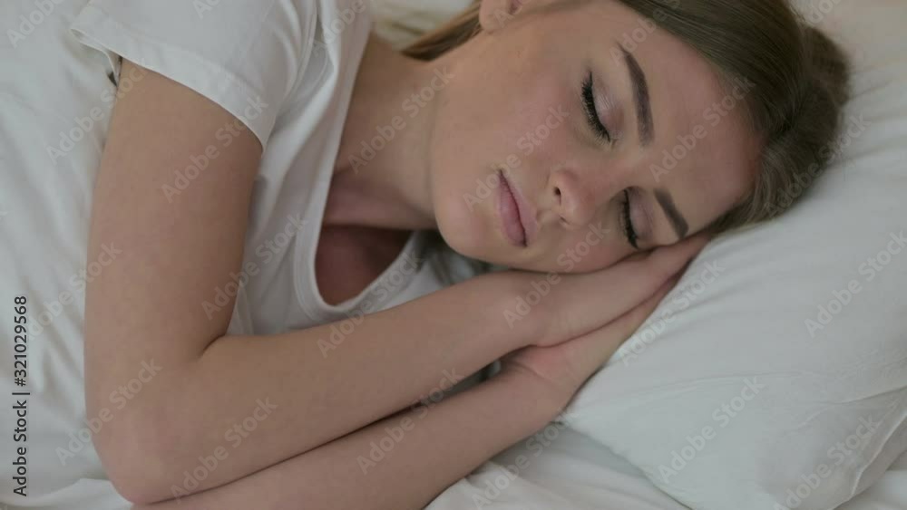 Portrait of Peaceful Young Woman Sleeping in Bed Portrait of Peaceful Young Woman Sleeping in Bed