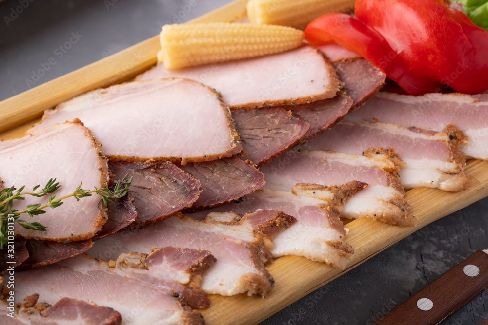 Macro view of smoked meat with marinated vegetables. Closeup Macro view of smoked meat with marinated vegetables. Closeup