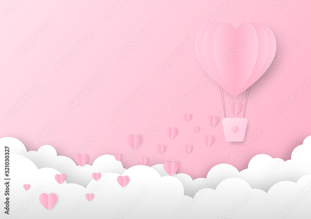 Pink paper heart shape balloon floating in the sky with some small hearts falling down