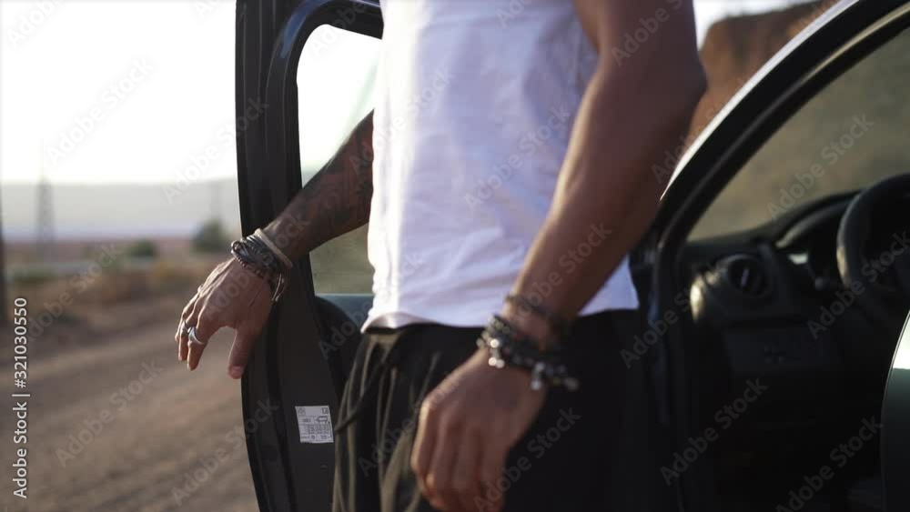 man getting out of a car