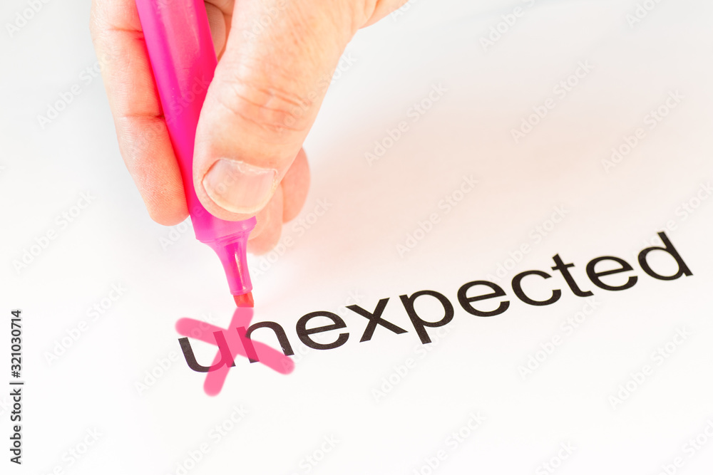 Φωτογραφία The prefix un of the word unexpected is crossed out with a pink pencil by a ha