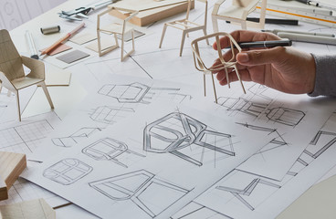 Designer sketching drawing design development product plan draft chair armchair Wingback Interior furniture prototype manufacturing production. designer studio concept .