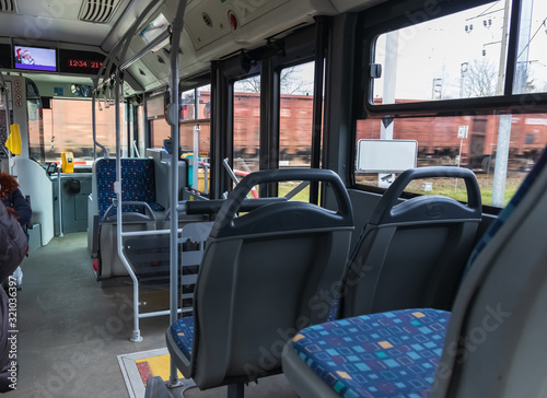Inside the city bus. Panoramic view from the rear seat.