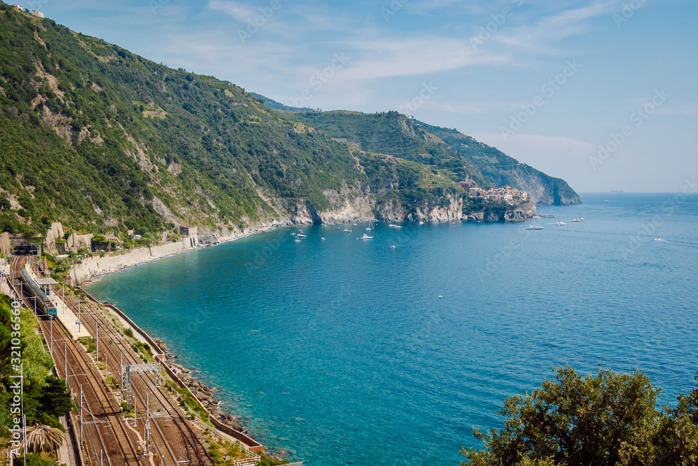 Aerial view of Corniglia train station, Cinque Terre, Italy. Railway along the picturesque Italian coast.
