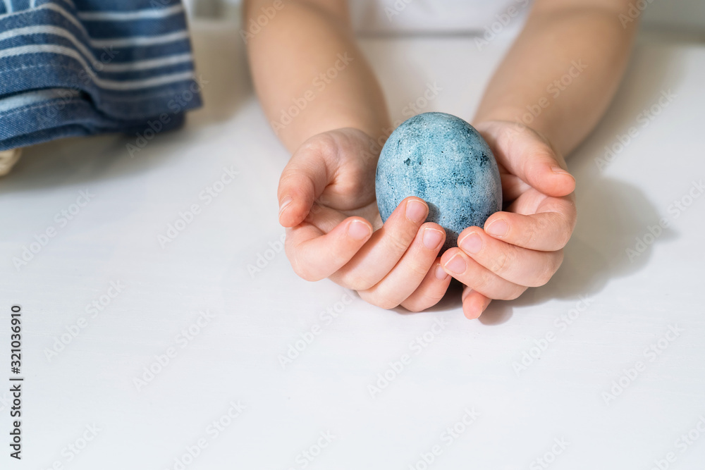 Beautiful egg painted for Easter. Close up of a blue egg Beautiful egg painted for Easter. Close up of a blue egg