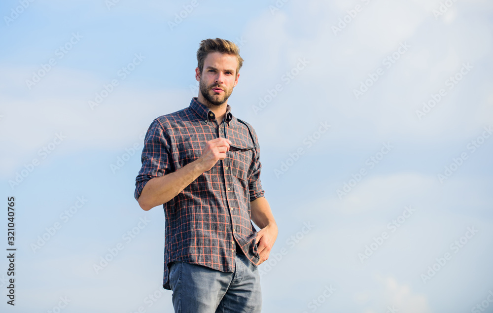 Feeling casual. male fashion style. looking very trendy. men beauty and sexuality. Real men. macho man unshaven face. businessman in glasses. confidence and charisma. sexy man sky background
