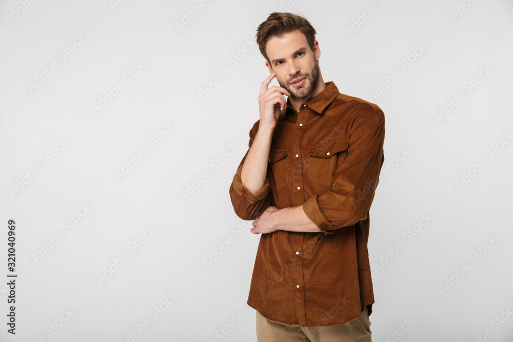 Portrait of unshaven young man posing and looking at camera Portrait of unshaven young man posing and looking at camera