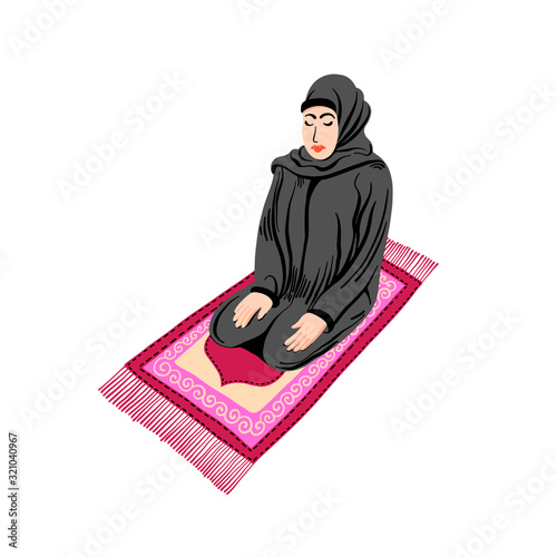arab muslim woman praying on a praying carpet