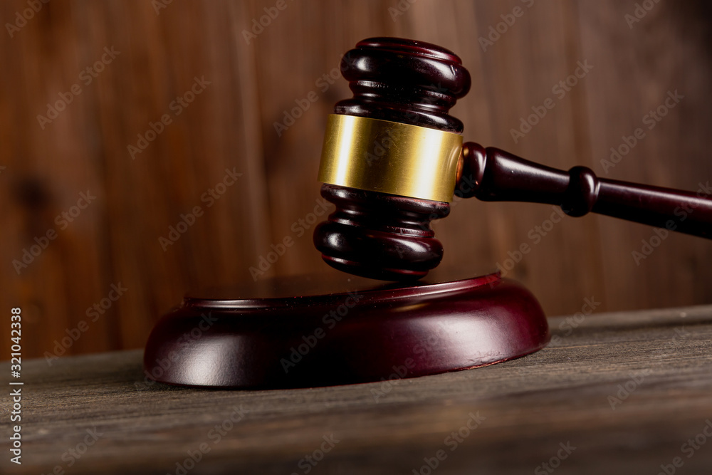 Wooden gavel on the table isolated. Wooden gavel on the table isolated.