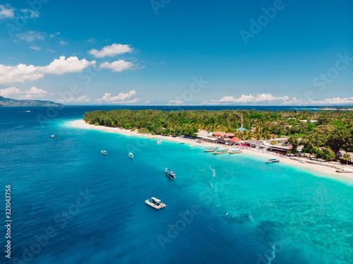 Tropical island with paradise beach and turquoise sea. Aerial view.