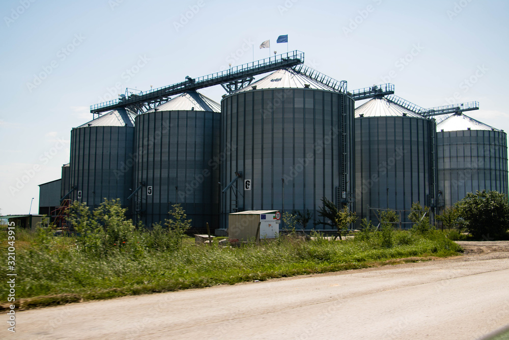 Grain Silo Bins in Farm Field Agricultural Landscape