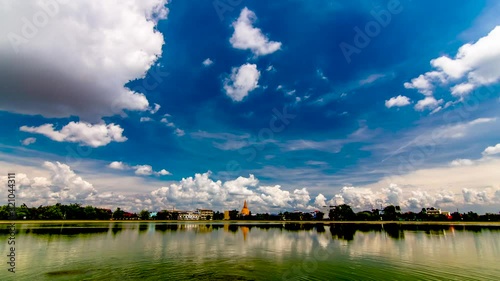 Timelapse white clouds gathered and flowing ,Above the reservoir in Thailand photo