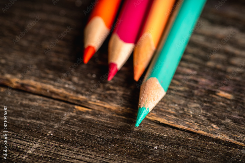 Pencil with sharpening shavings on the rustic background. Selective focus. Shallow depth of field. Pencil with sharpening shavings on the rustic background. Selective focus. Shallow depth of field.