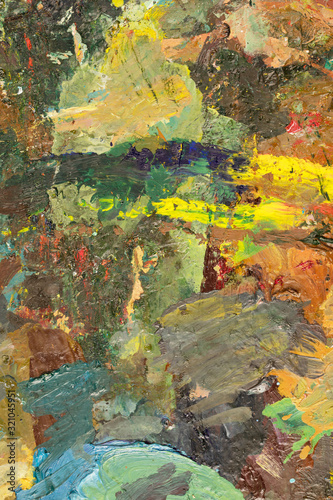 Background image of bright oil-paint palette closeup.