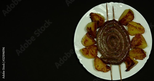 Stop motion. Sausage with potatoes. German traditional cuisine
