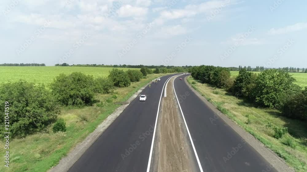 Aerial panoramic top view shot flying sky drone copter footage, tracking of group of cyclists Aerial panoramic top view shot flying sky drone copter footage, tracking of group of cyclists