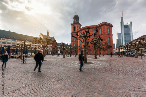 Paulplatz with a view of Paulskirche, famous Church in Frankfurt and skyscarpers against of dramatic sky, Germany photo