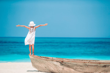 Cute little girl at beach during summer vacation