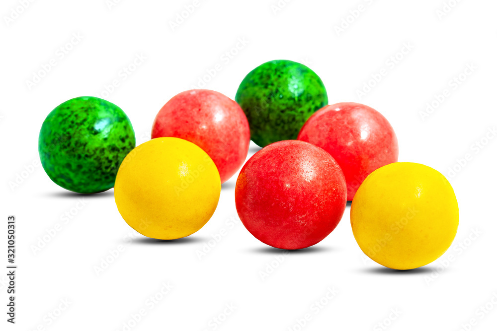 Sweet colorful caramel round candies red, green and yellow on a white background. Delicious sugar lollipop balls with fruit filling. Sweet colorful caramel round candies red, green and yellow on a white background. Delicious sugar lollipop balls with fruit filling.